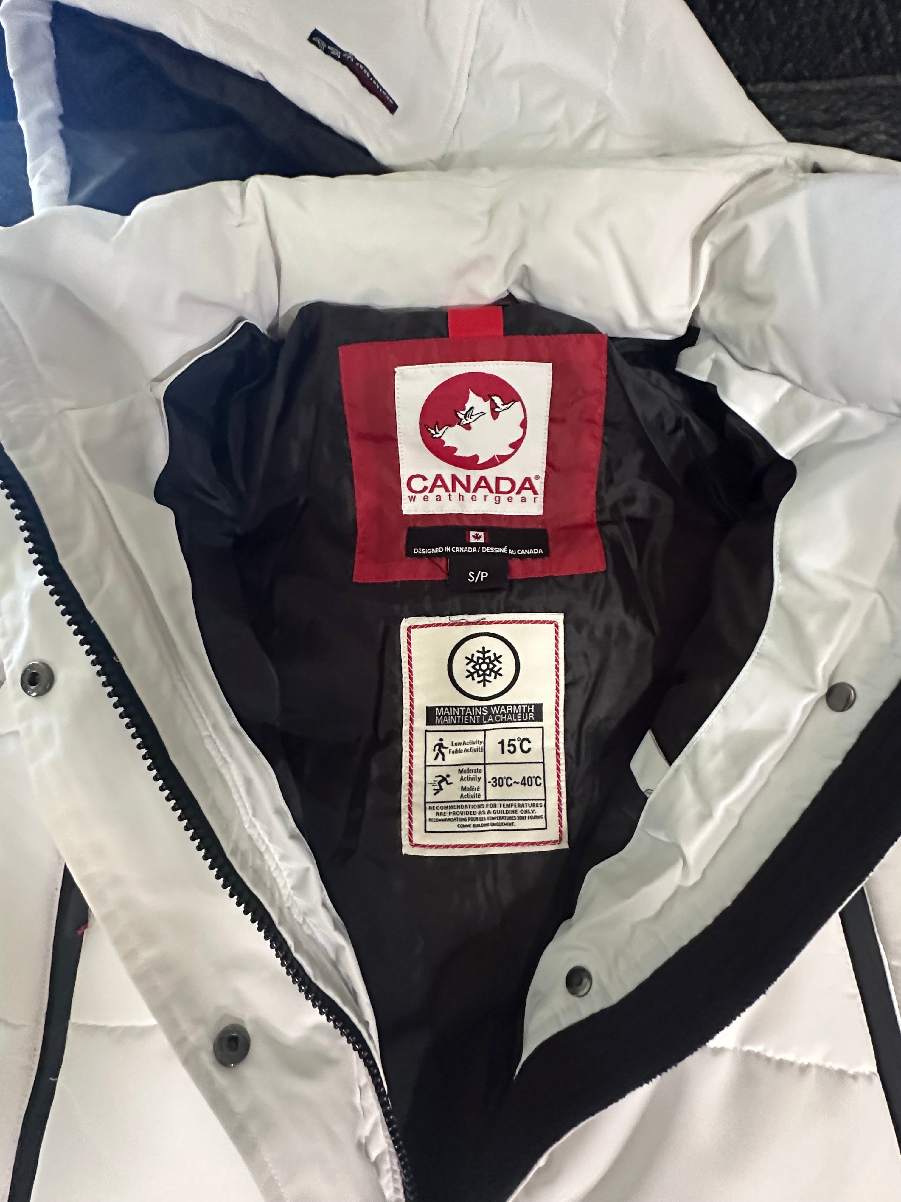 Canada weather gear women's extra long quilted maxi parka jacket. In small size. White color.