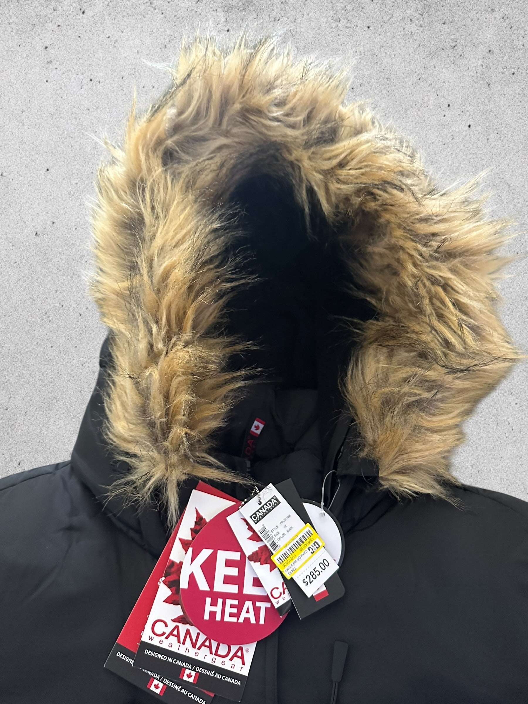 Canada weather gear women's heavyweight long length bubble puffer parka. In 1X size in black color.