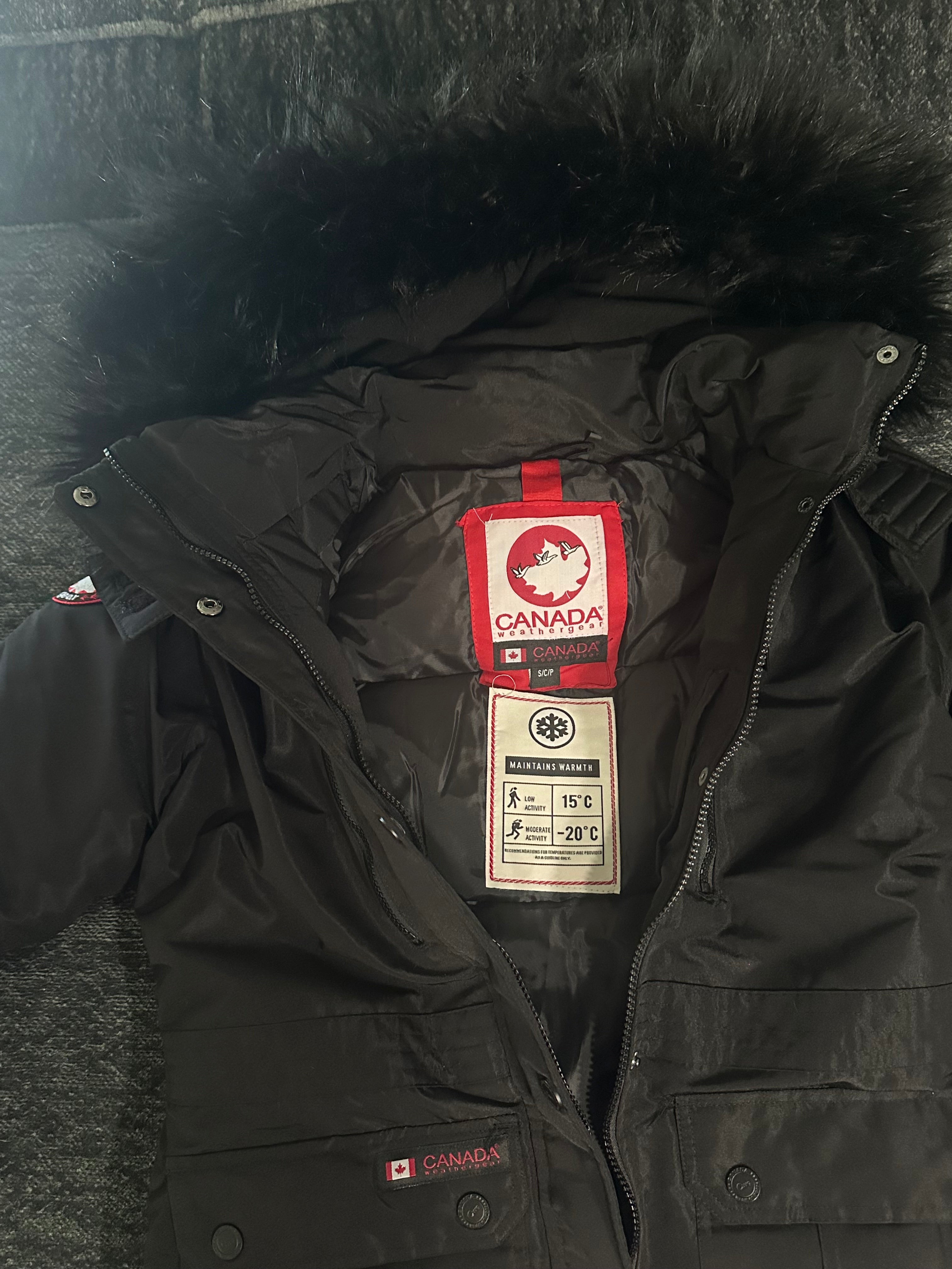 Canada weather gear women's fur hooded long line winter parka in small size in a black color. Black fur hood.