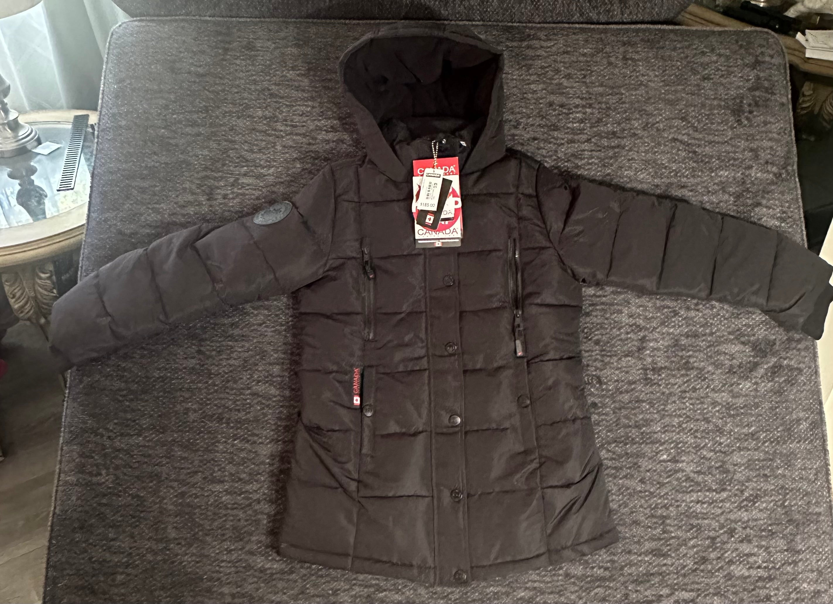 Canada weather gear girls large 14/16 stadium length quilted puffer parka in a black color.