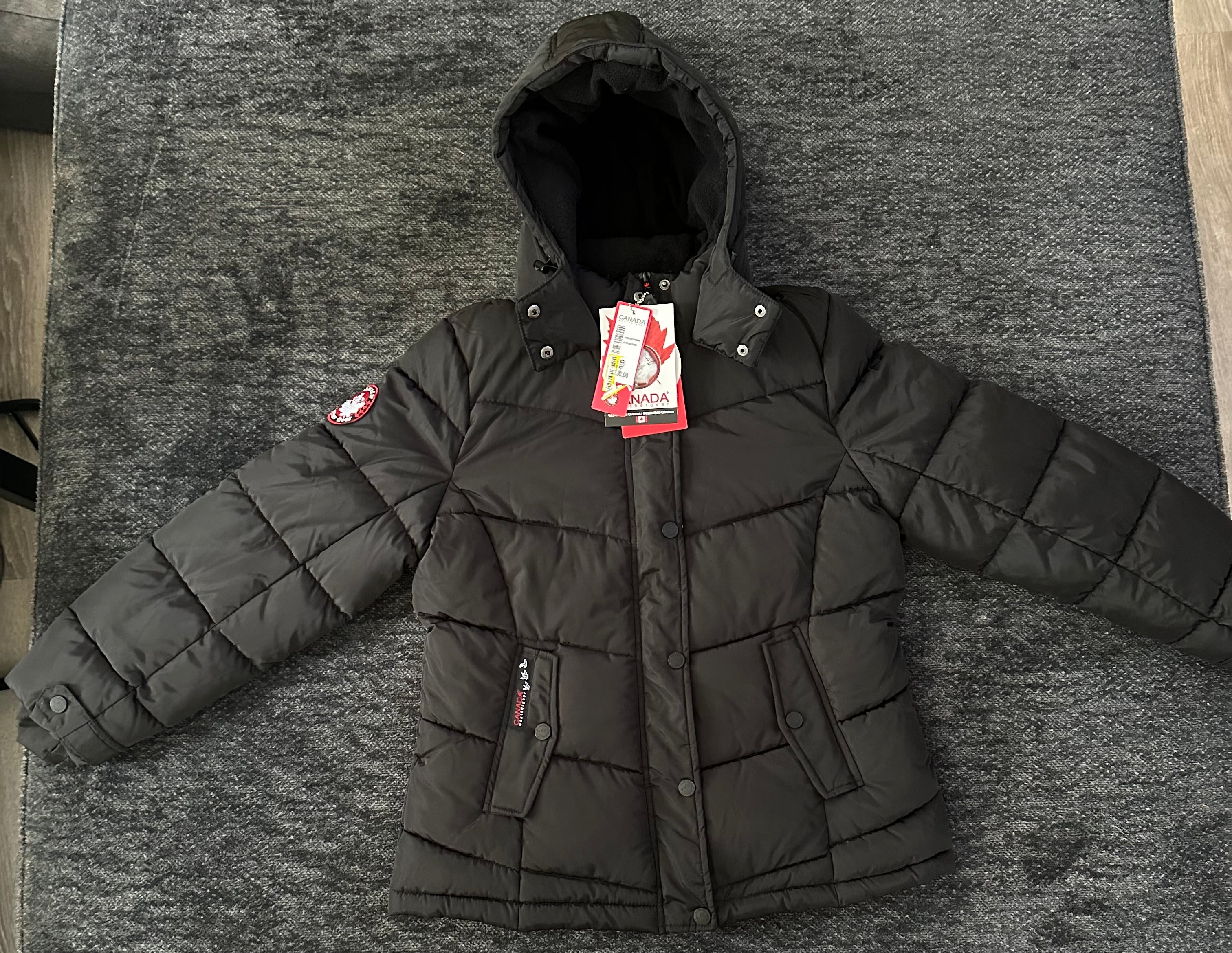 Canada weather gear women's medium quilted winter jacket in a black color.