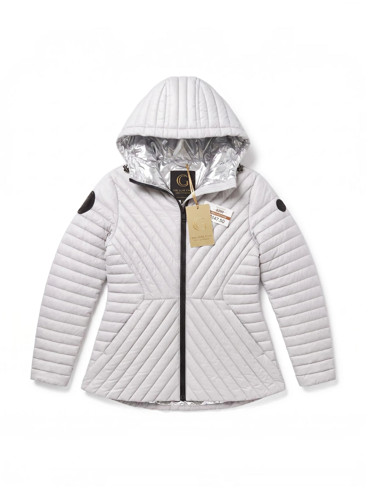 A white quilted hooded jacket with a silver reflective lining inside the hood, featuring a black front zipper and black circular patch details on the sleeves, shown against a plain white background. ##White