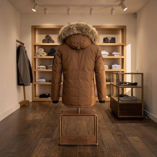 LUXAZON boys' brown heavyweight parka jacket with a faux fur-trimmed hood, displayed on a stand in a retail store.
