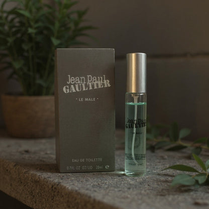 LUXAZON Jean Paul Gaultier Le Male eau de toilette 0.7 fl oz spray bottle and grey box on a stone surface